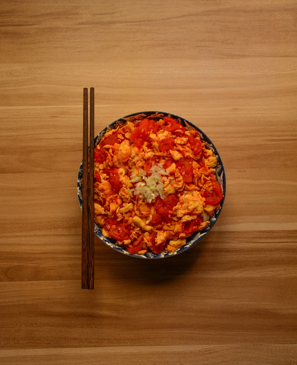Chinese tomato egg stir-fry with soft egg curds and tomato sauce.